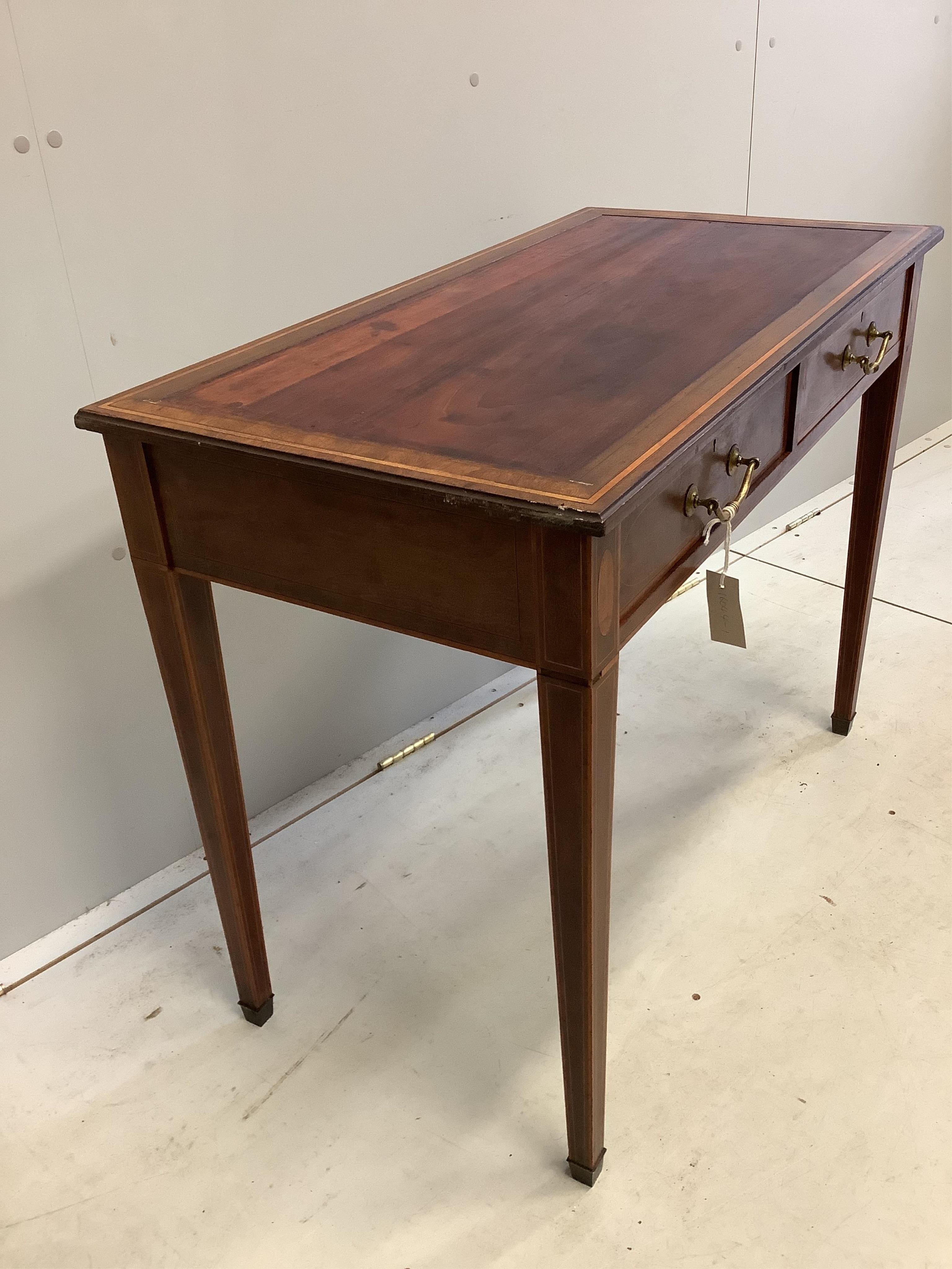 An Edwardian Edwards and Roberts satinwood banded mahogany writing table, width 91cm, depth 47cm, height 72cm. Condition - fair, lacks leather top